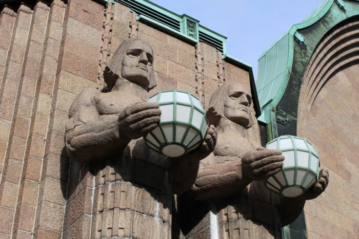 helsinki train station statues 700x467