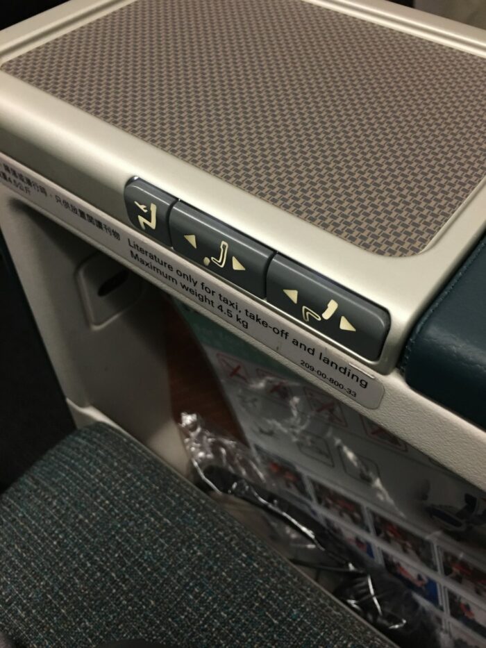 cathay pacific business class armrest 700x933