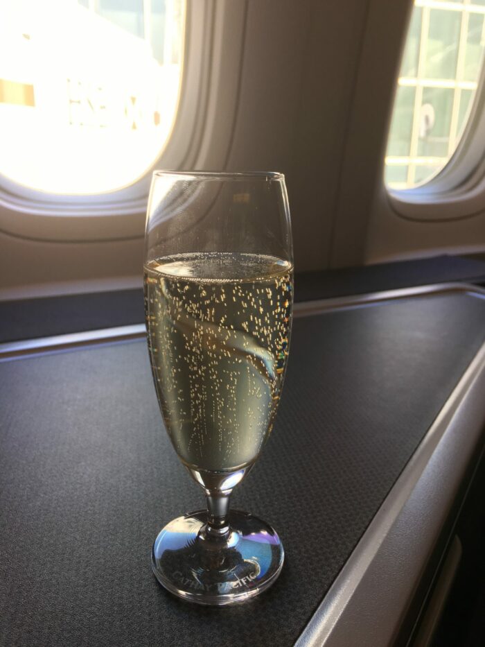cathay pacific business class champagne 700x933