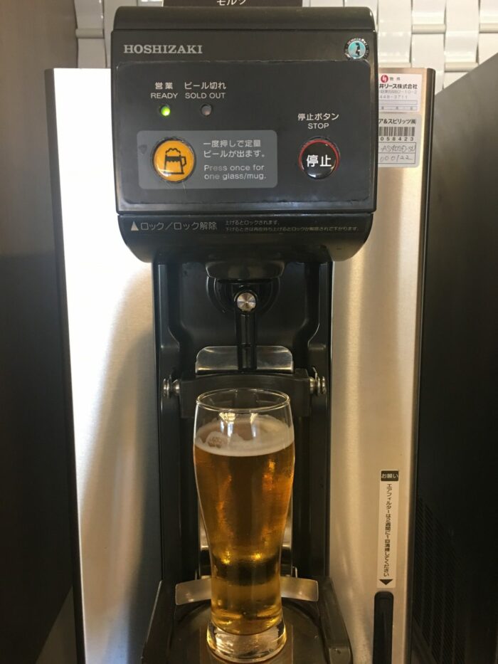 jal sakura lounge osaka beer machine 700x933