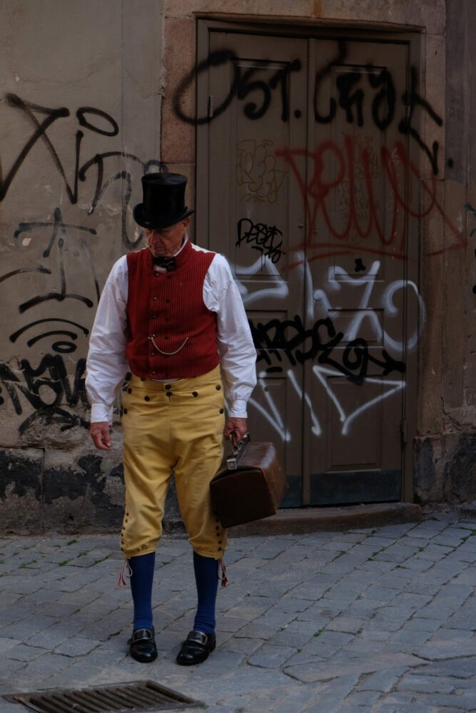 man in costume graffiti stockholm 667x1000
