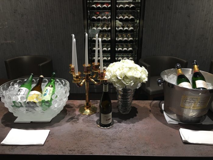 jal first class lounge tokyo haneda champagne sake 700x525
