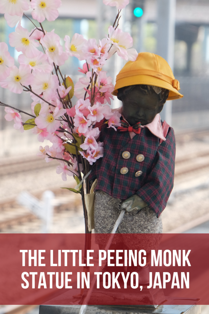 the little peeing monk statue in tokyo japan 667x1000