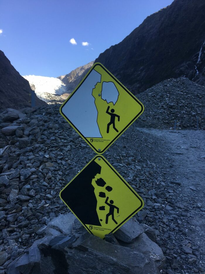 glacier warning sign 700x933 - Hiking to Franz Josef Glacier, New Zealand