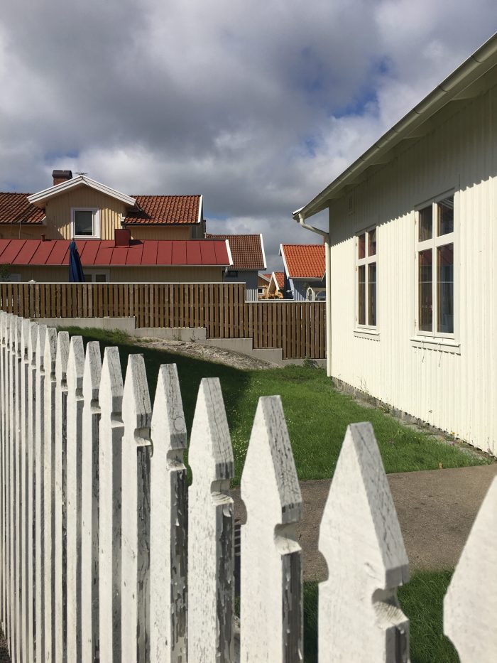 marstrand painted houses white picket fences 700x933 - A day trip to Marstrand from Gothenburg including Match Cup Sweden & fortress
