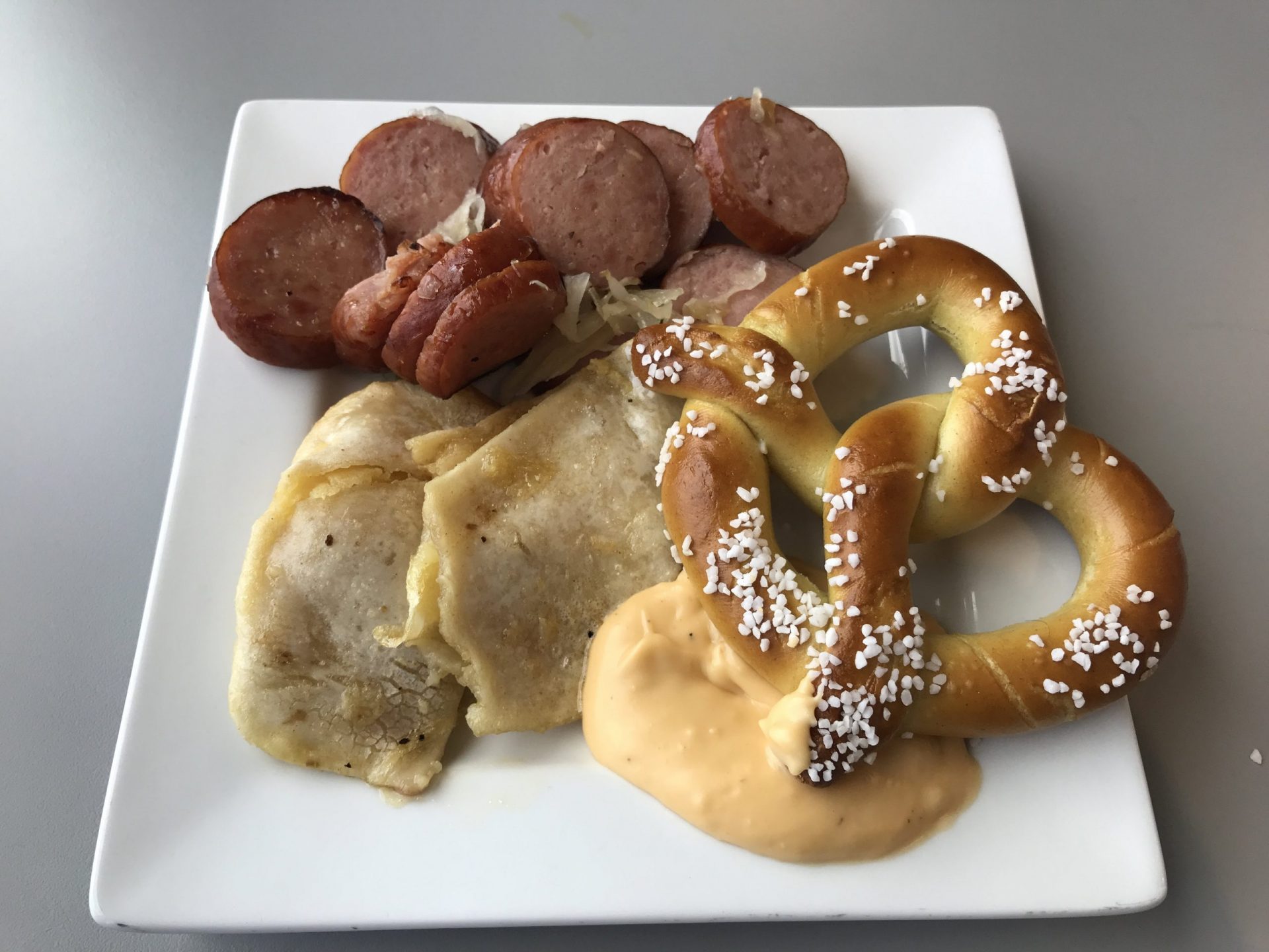 the club pittsburgh lounge kielbasa pierogies pretzel scaled - The Club at Pittsburgh International Airport review