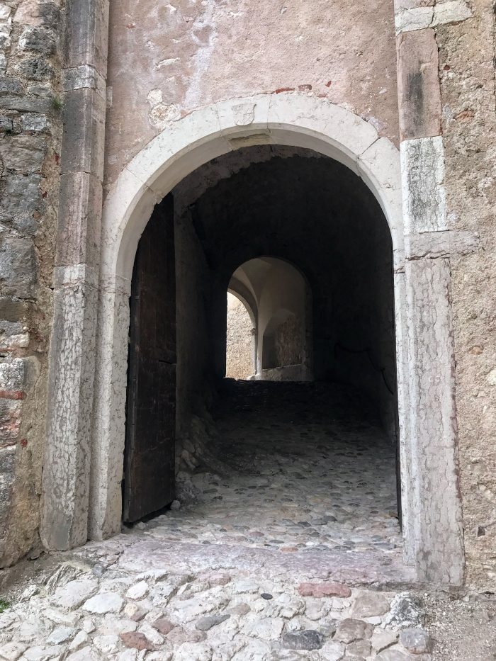castel beseno dark gate 700x933 - A visit to Castel Beseno near Trento, Italy