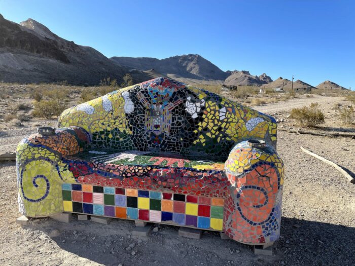sofie siegmann sit here goldwell open air museum rhyolite 700x525 - Rhyolite, Nevada - From Gold Rush Boomtown to Ghost Town