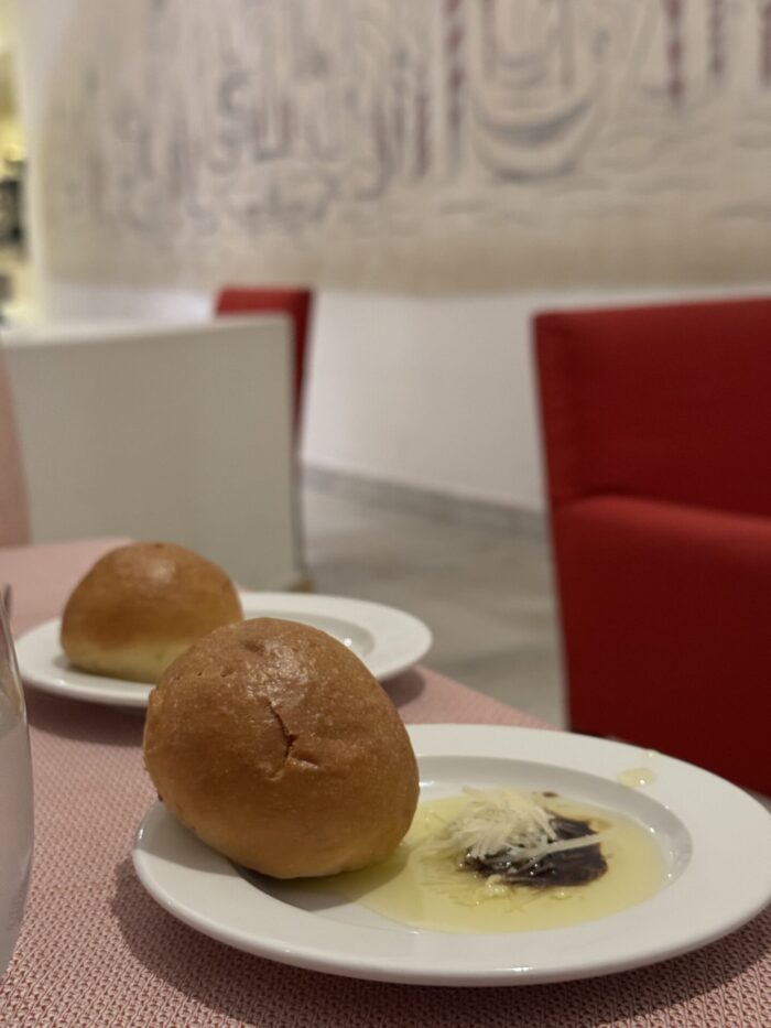 What It's Like To Eat & Drink At An All-Inclusive Resort In Oaxaca, Mexico secrets huatulco cin cin italian restaurant bread cart 700x933